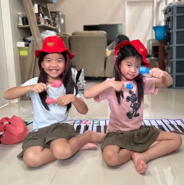 Children enjoying rhythm activities with colorful shakers