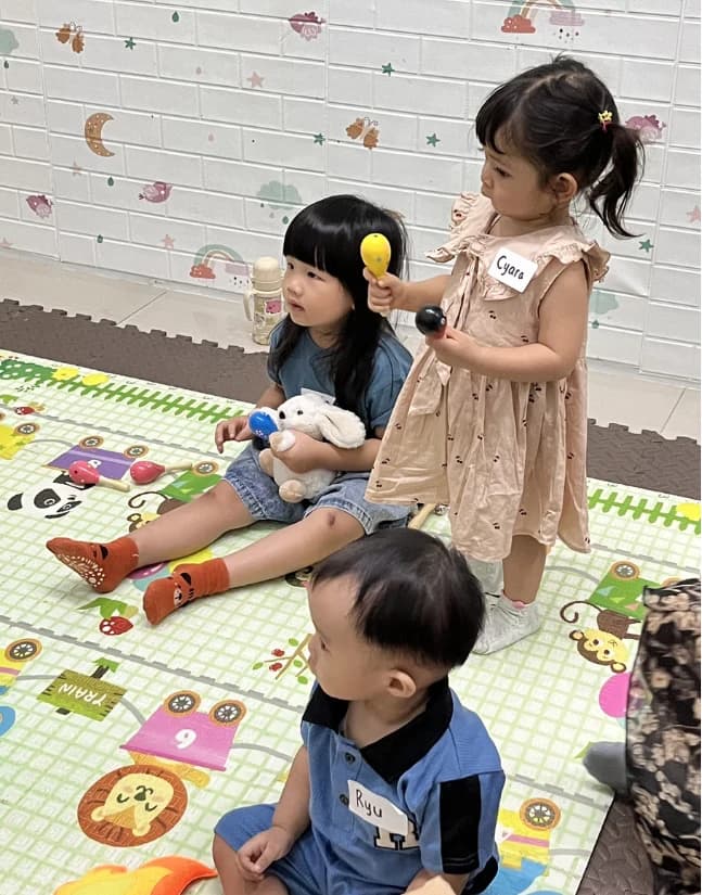 Children exploring sounds and creative play at Makaku Class